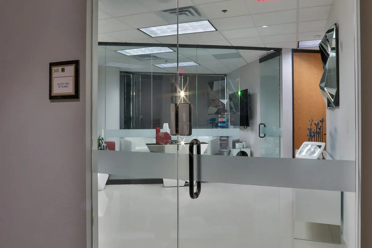 A view of a room through the glass door.